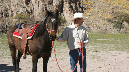 Reed Peters horseback riding at Hideout Ranch